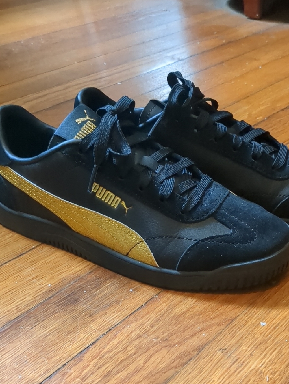 Puma Black & Gold Suede Sneakers